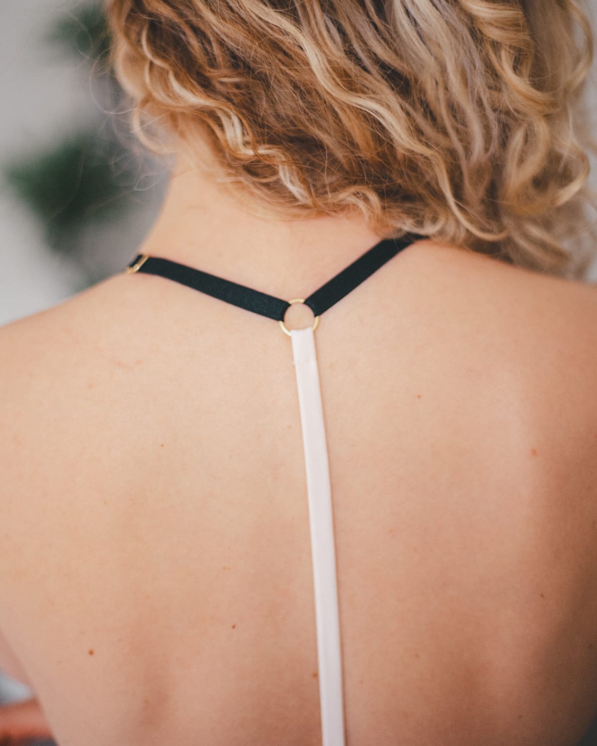 Vivi Leigh London model detail of a back racer back satin strap